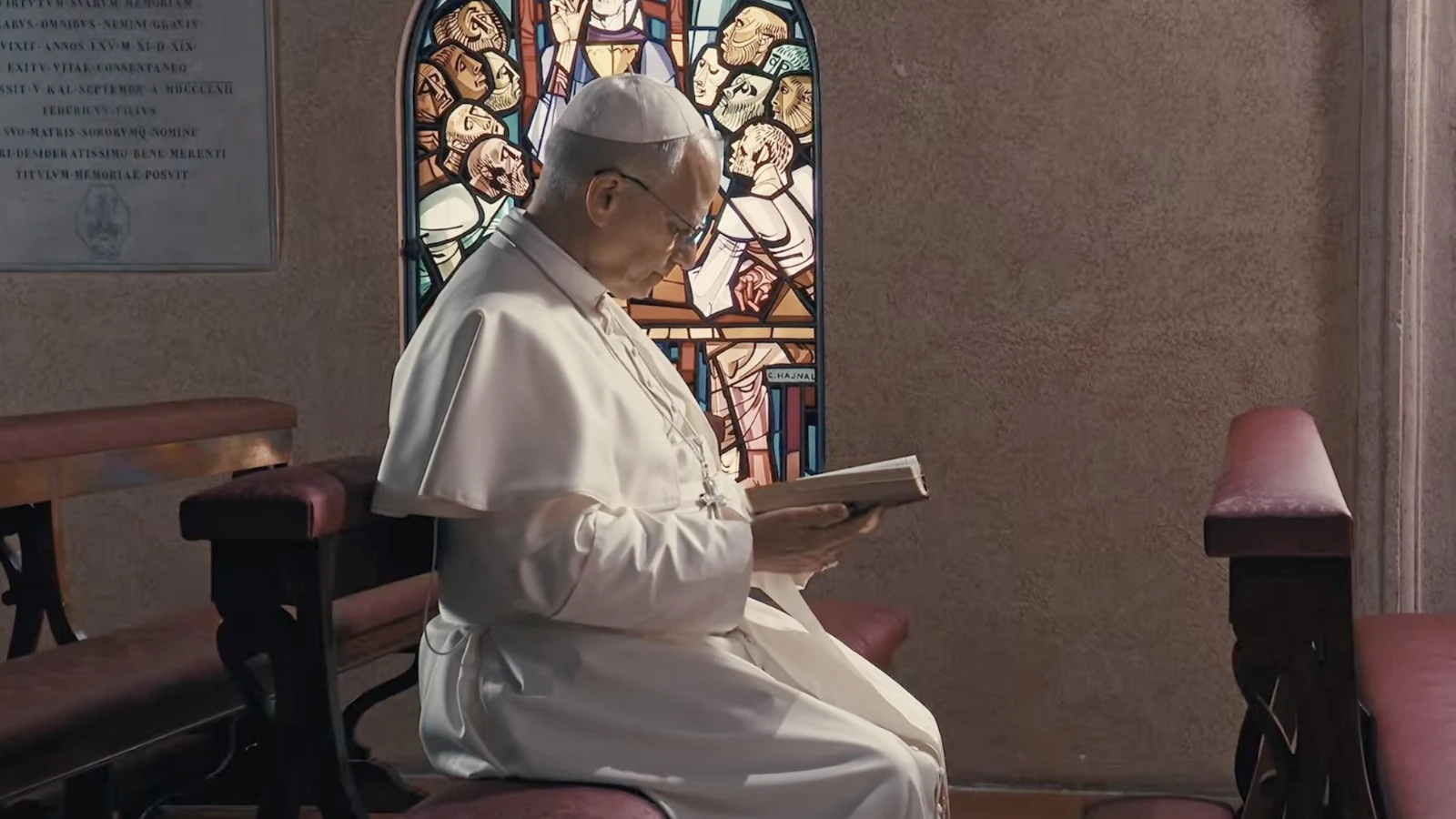 Pope Leo XIV praying in a chapel